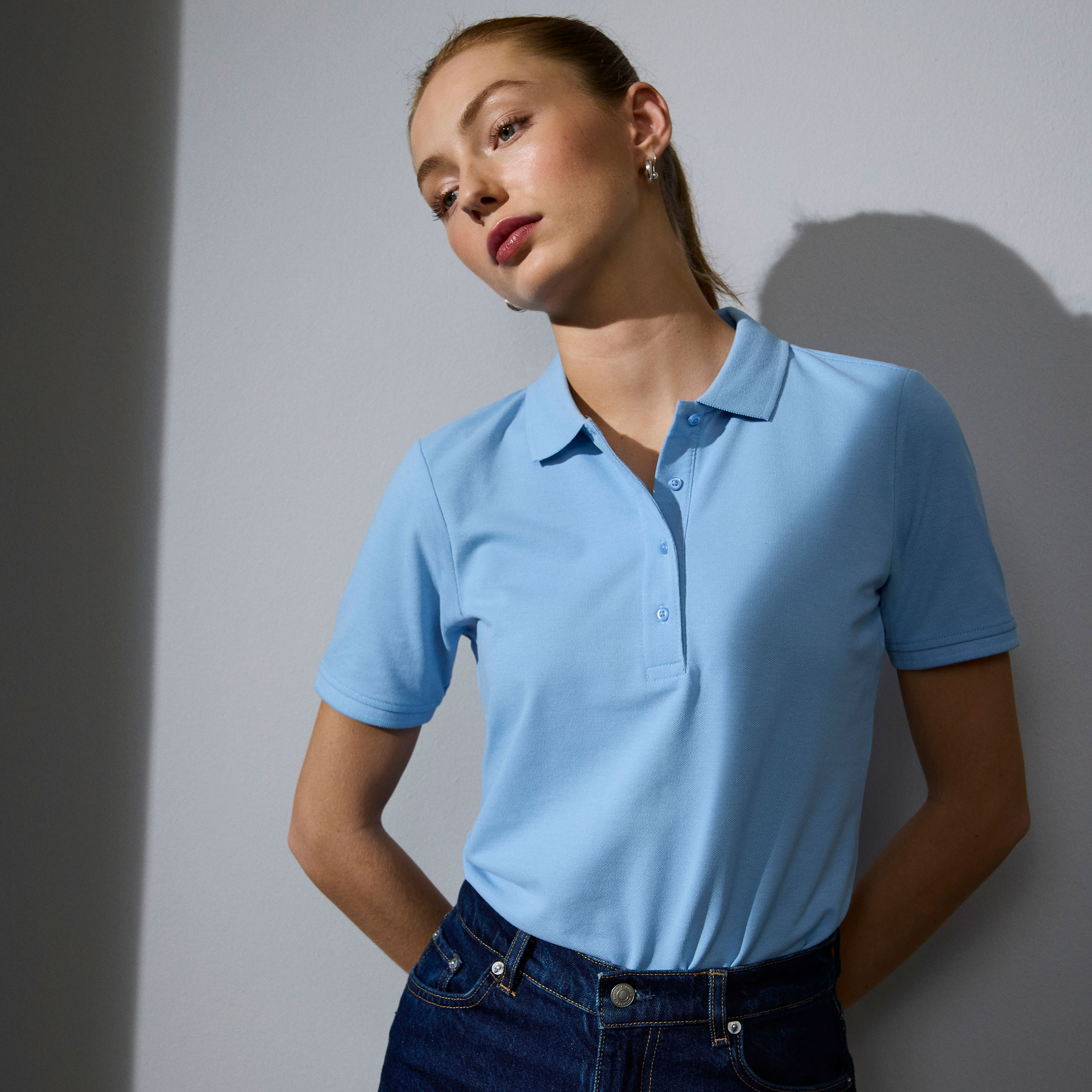 ID PRO Wear CARE women's polo shirt, Light Blue